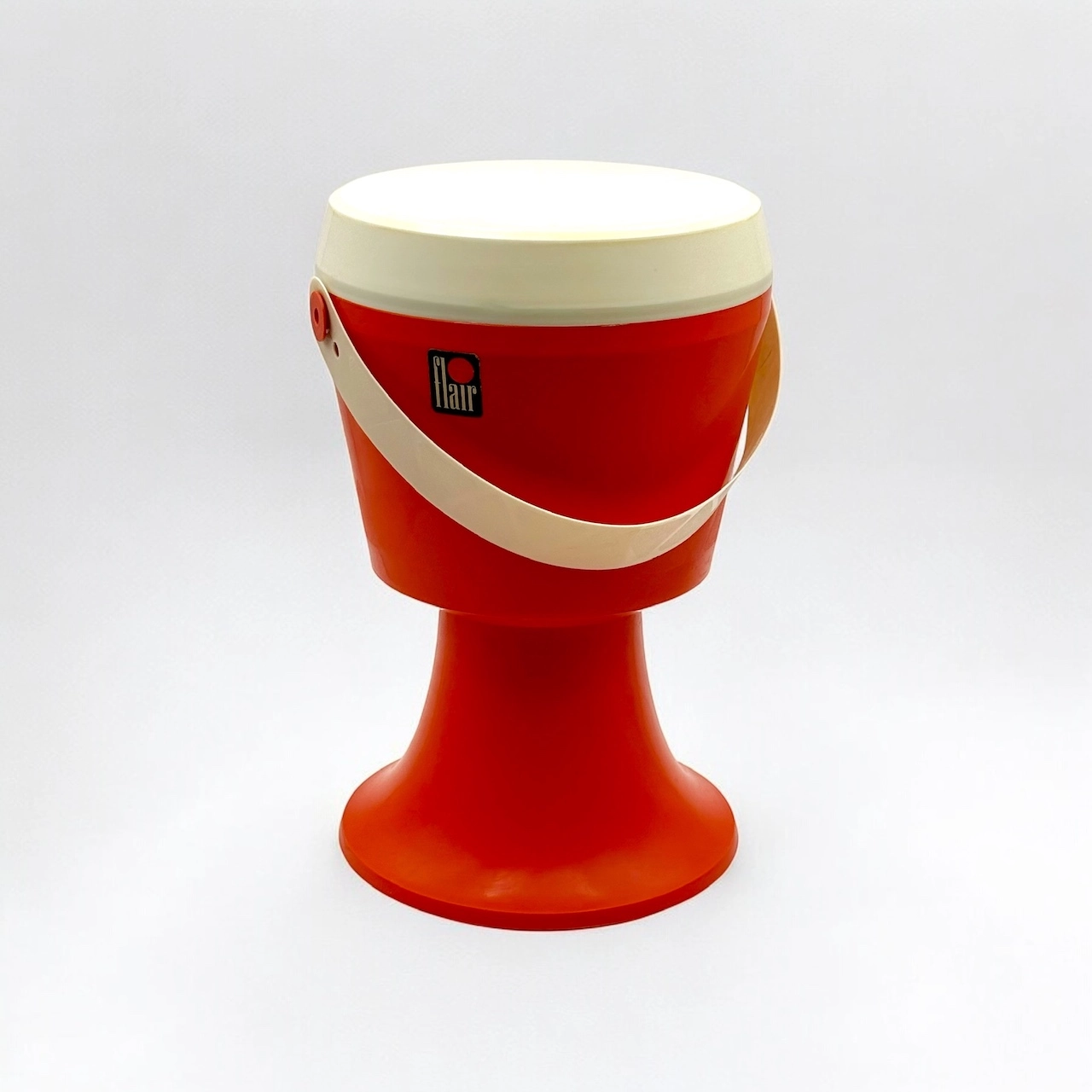 Pop orange plastic stool with hidden storage, designed by Flair in the 1970s, example of playful modular furniture