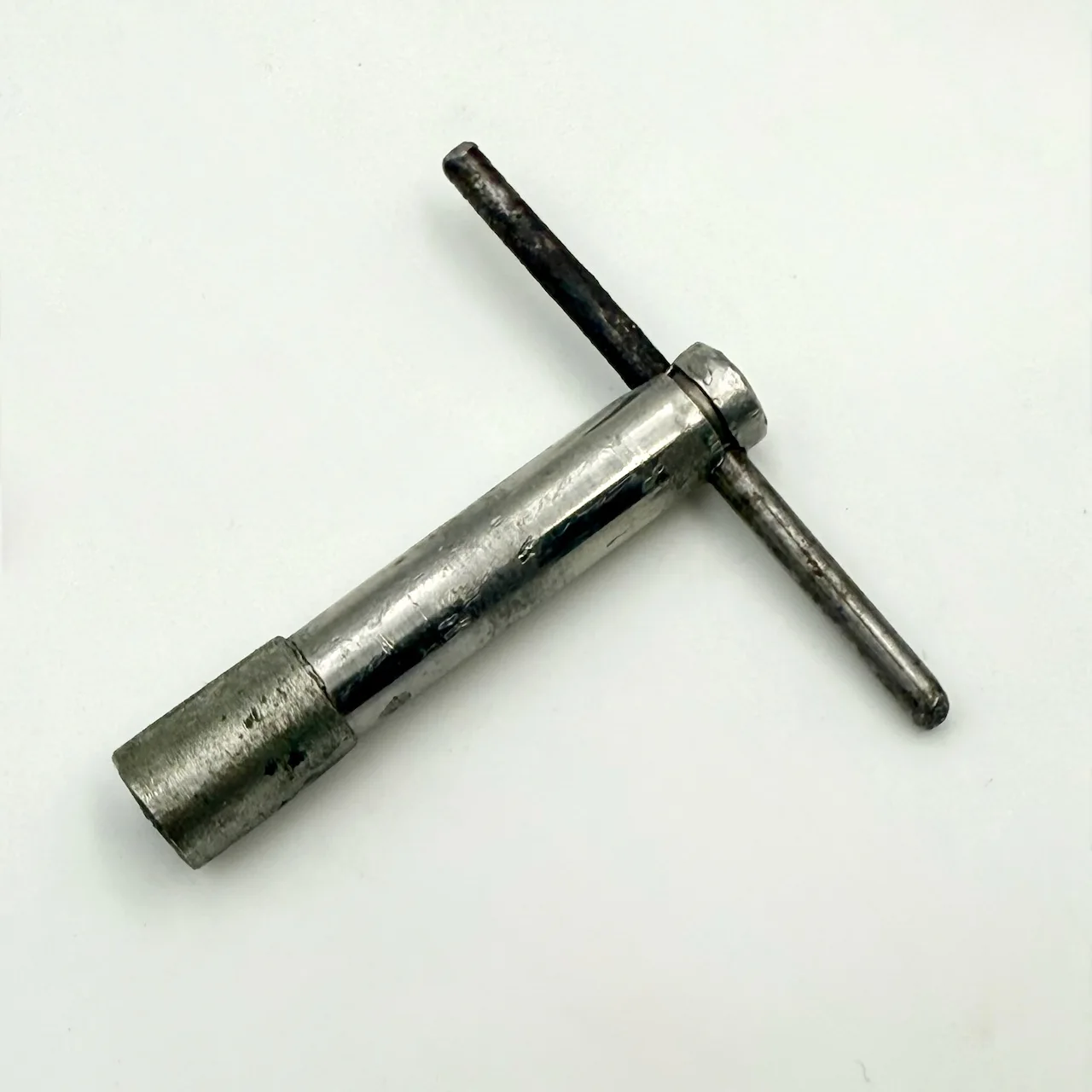 Authentic vintage French wall clock by FFR 1950s, black and ivory Formica with coral edge, brass hands, glass window and original key, Made in France