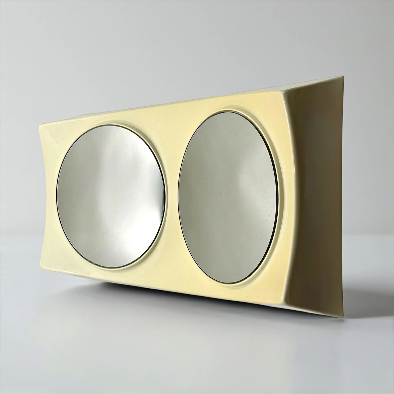 Rare UFO wall mirror in flexible ivory plastic Italian Space Age design 1970s