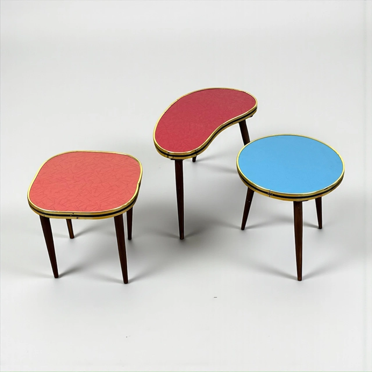 Set of Mid Century plant stands with colorful Formica tops and brass edges, 1950s West German design