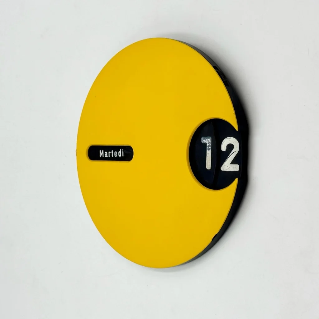 Perpetual wall calendar Italian yellow round design 1970s