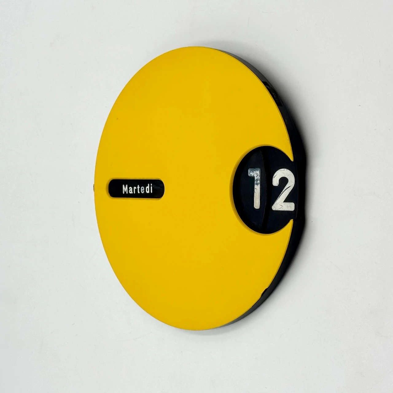 Perpetual wall calendar Italian yellow round design 1970s