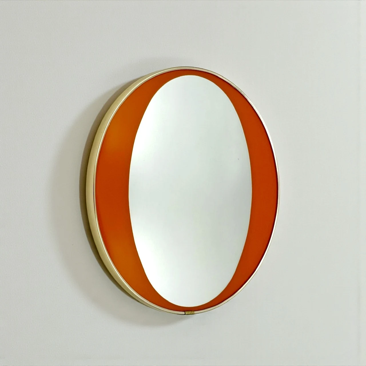 1970s orange mid century mirror with brass frame