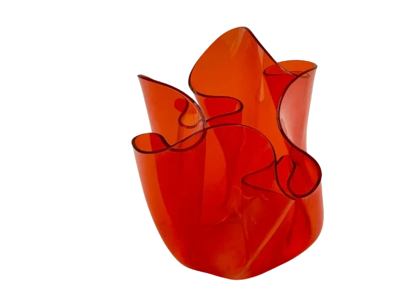 Orange blown-glass sculpture with ruffled, curved edges, resembling a vase or centerpiece piece.