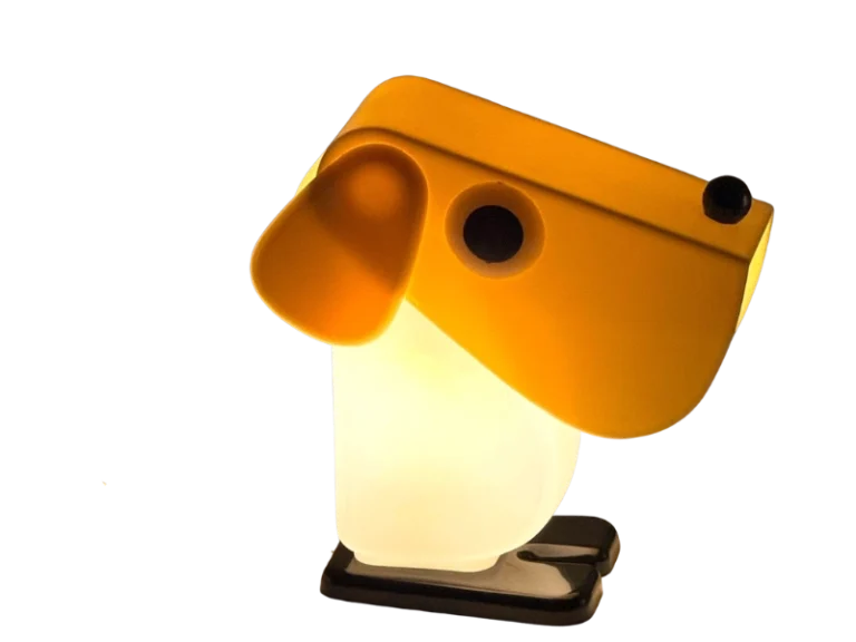 Rufus Dog table lamp by Fernando Cassetta for Tacman, yellow postmodern design lamp illuminated against a neutral background